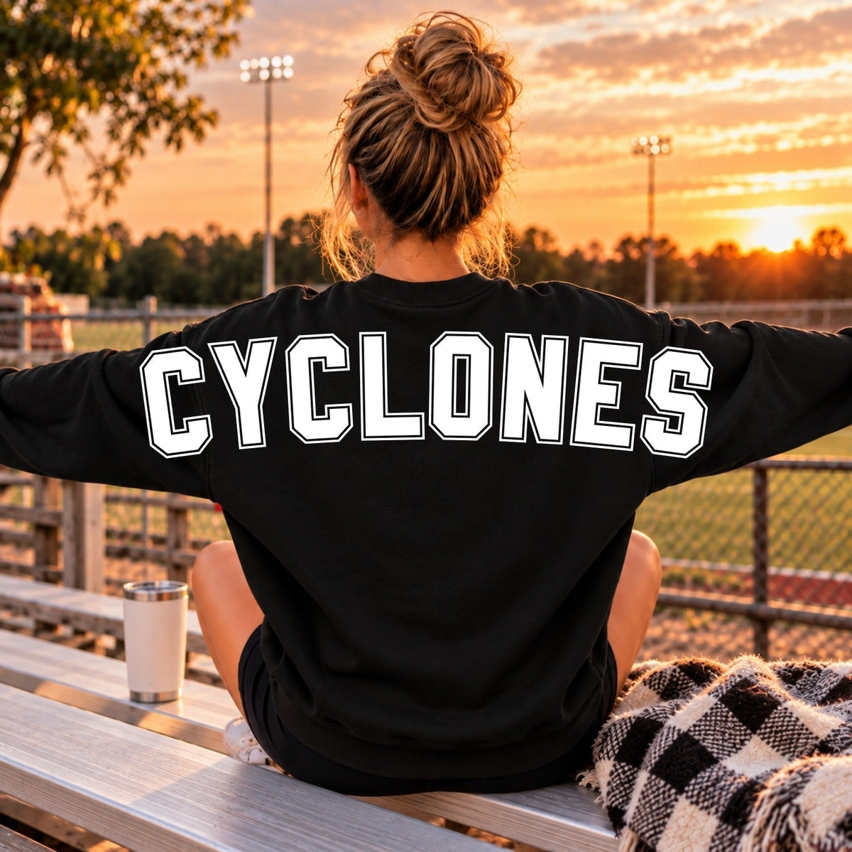 White outline Cyclones lettering on the back of a black sweatshirt