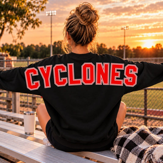 Red Cyclones lettering with white and black outline on black sweatshirt